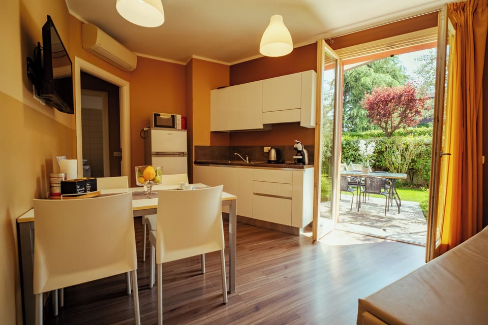 Superior Apartment | Living area | 32-inch LCD TV with digital channels, TV, heated floors