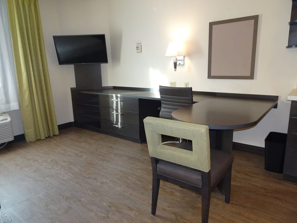 Desk, laptop workspace, blackout drapes, iron/ironing board