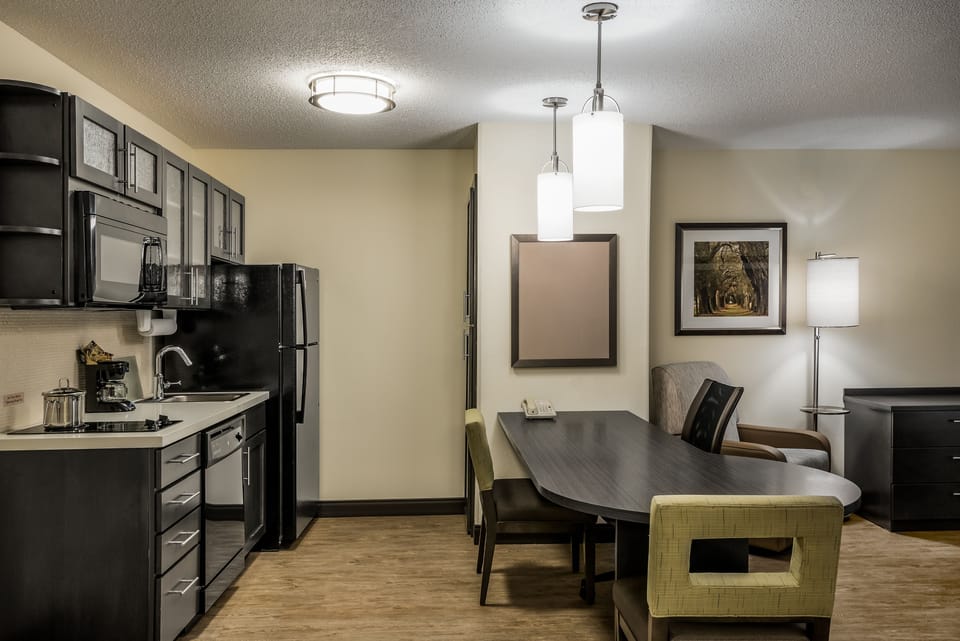Desk, laptop workspace, blackout drapes, iron/ironing board