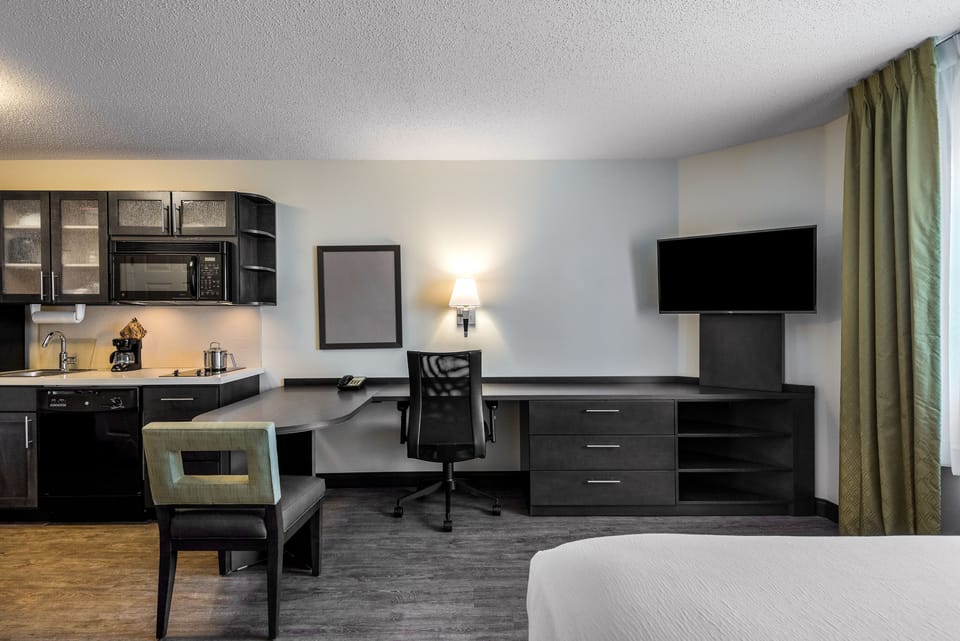 Desk, laptop workspace, blackout drapes, iron/ironing board