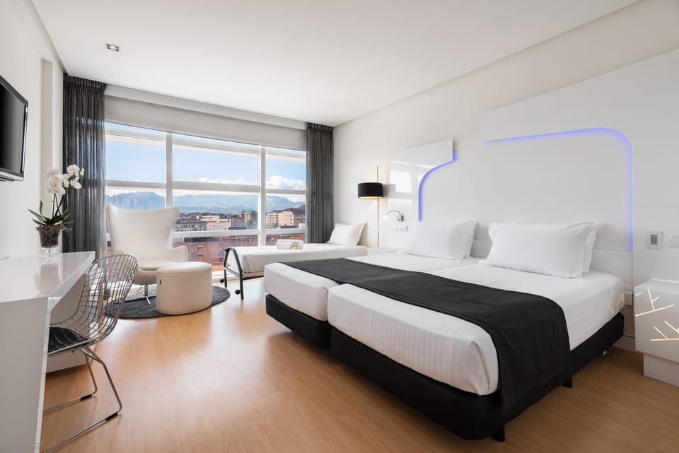 Triple Room | Minibar, in-room safe, desk, soundproofing