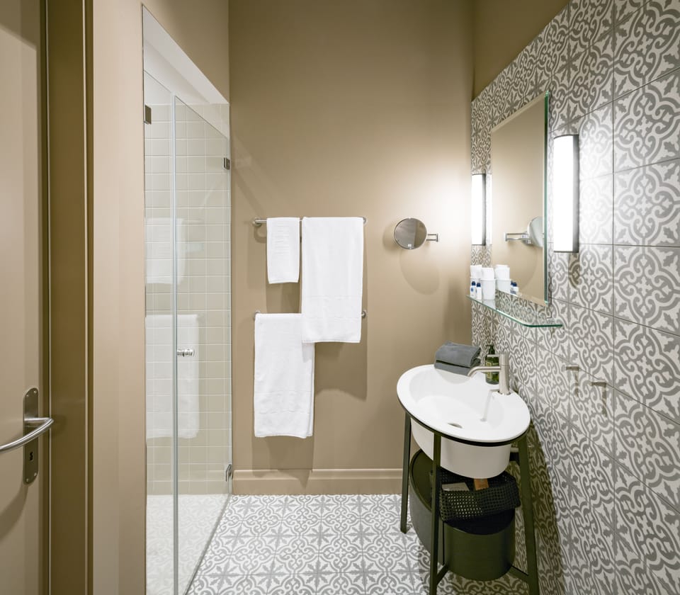 Shower, rainfall showerhead, designer toiletries, hair dryer