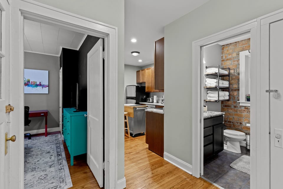 Hallway leading to bedrooms, bathroom and kitchen