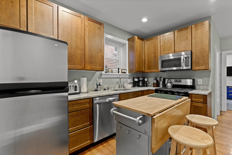 Kitchen has dishwasher, stove, fridge, pots & pans, dining ware, tea, sugar, etc