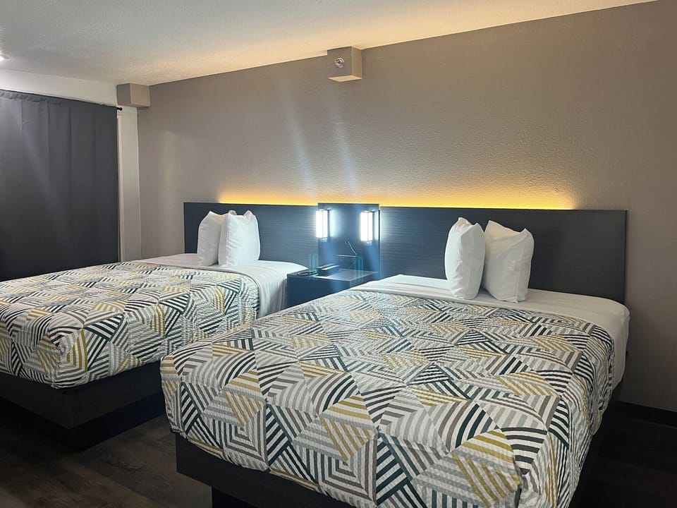 Premium bedding, blackout drapes, free WiFi, bed sheets