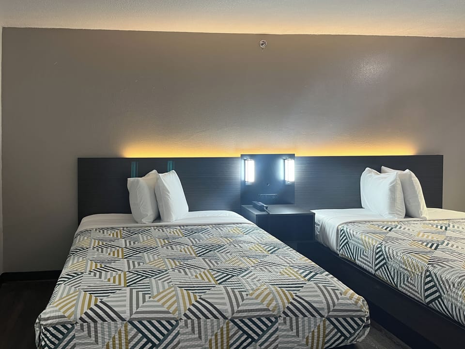 Premium bedding, blackout drapes, free WiFi, bed sheets