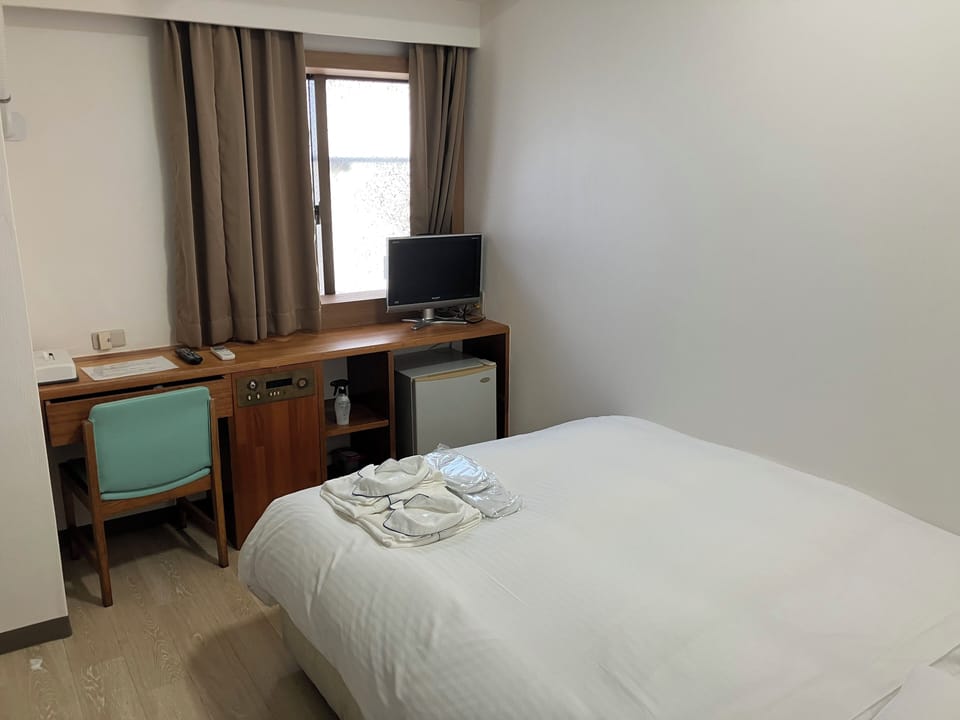 Desk, blackout drapes, WiFi (free), bed sheets