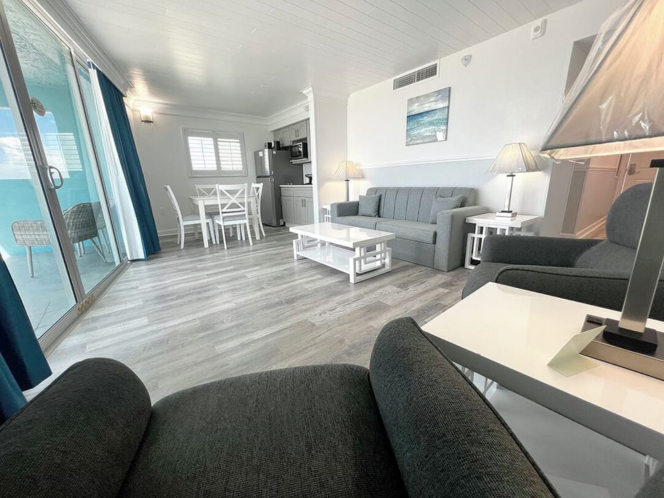 Suite with King Bed, Beachfront, Balcony | Living area | Flat-screen TV