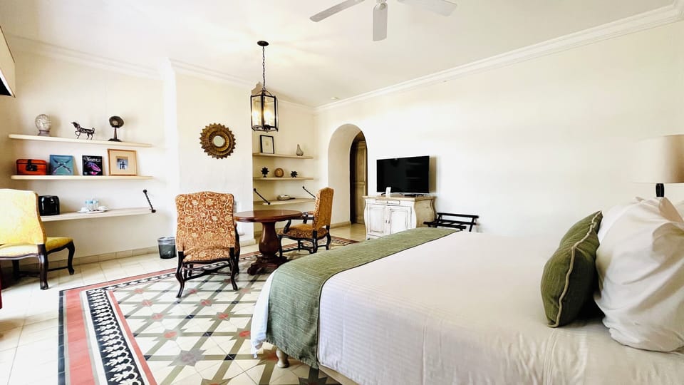 Suite, 1 King Bed | In-room safe, blackout drapes, iron/ironing board, free WiFi