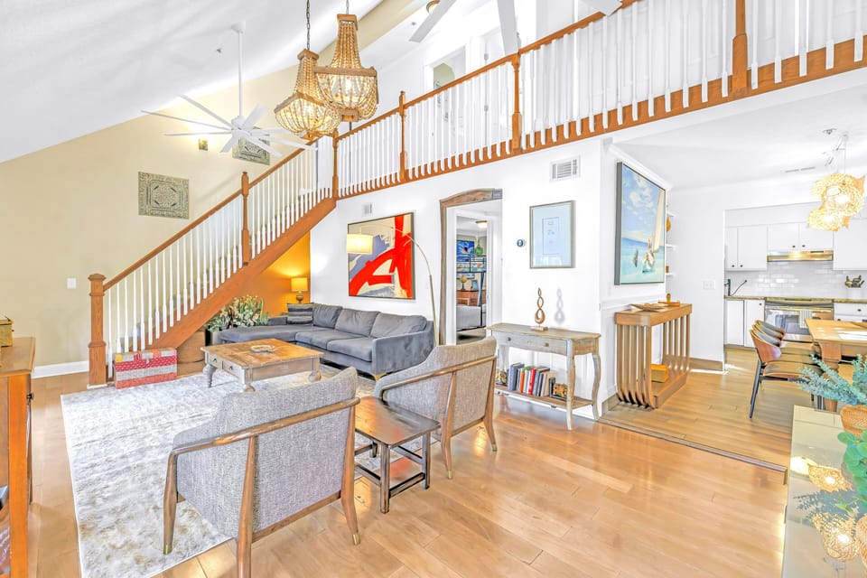 Open sunny living area and bohemian decor.