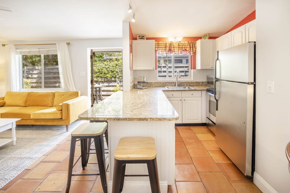 Breakfast bar for four with door to patio.