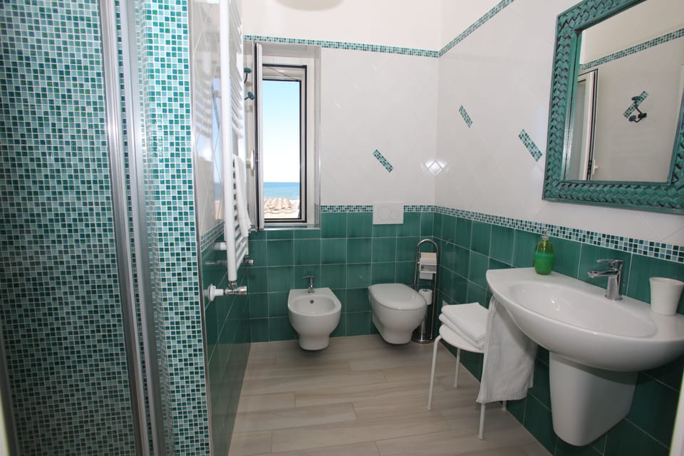 Double Room | Bathroom | Shower, hair dryer, bathrobes, bidet