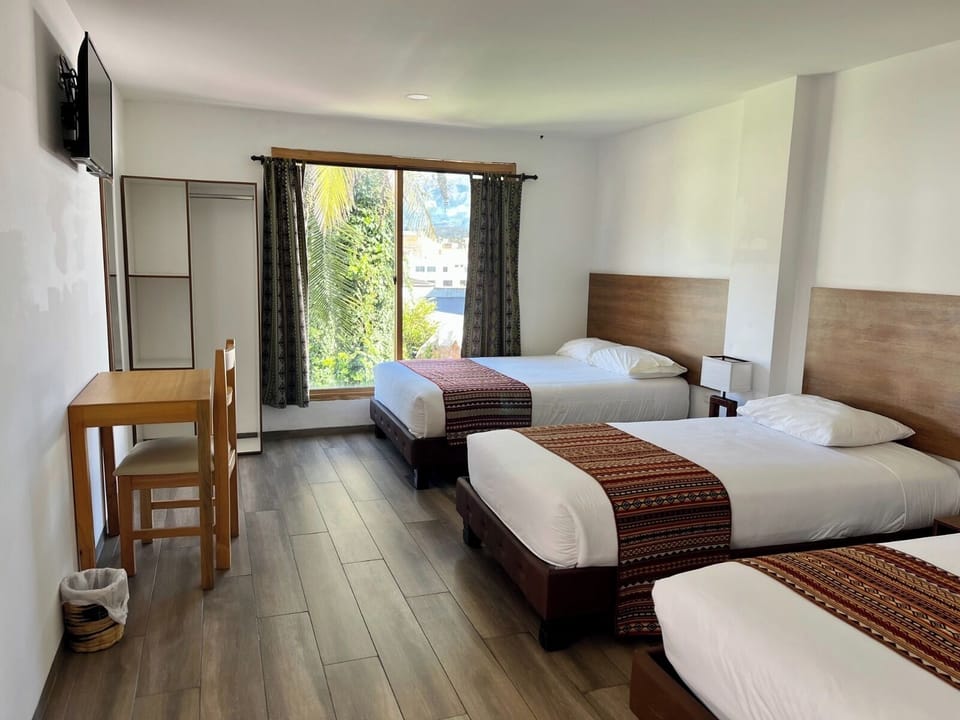Family Triple Room, Multiple Beds | Desk, laptop workspace, WiFi (free), bed sheets