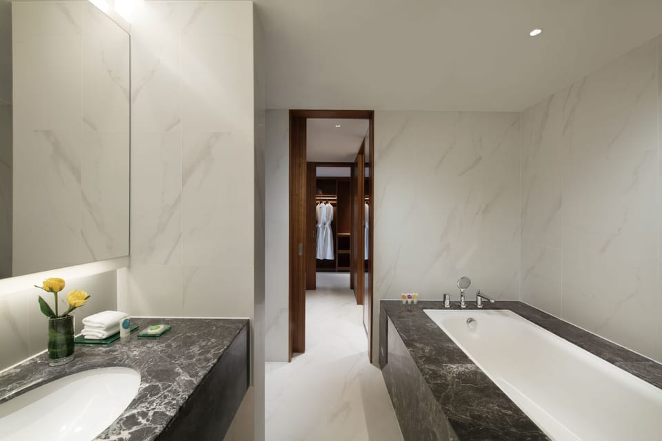 Rainfall showerhead, designer toiletries, hair dryer, slippers