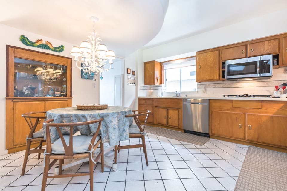 The kitchen is located on the first level and includes a breakfast table with seating for 4. It opens out to the media room.
                