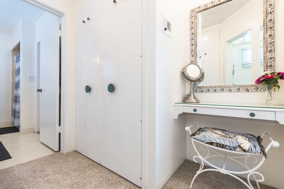 The primary bathroom is conjoined with a hallway bathroom. A privacy door can be shut to separate the two bathrooms.
                
