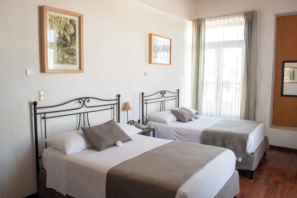 Standard Double Room, 2 Double Beds | Minibar, in-room safe, individually decorated, desk