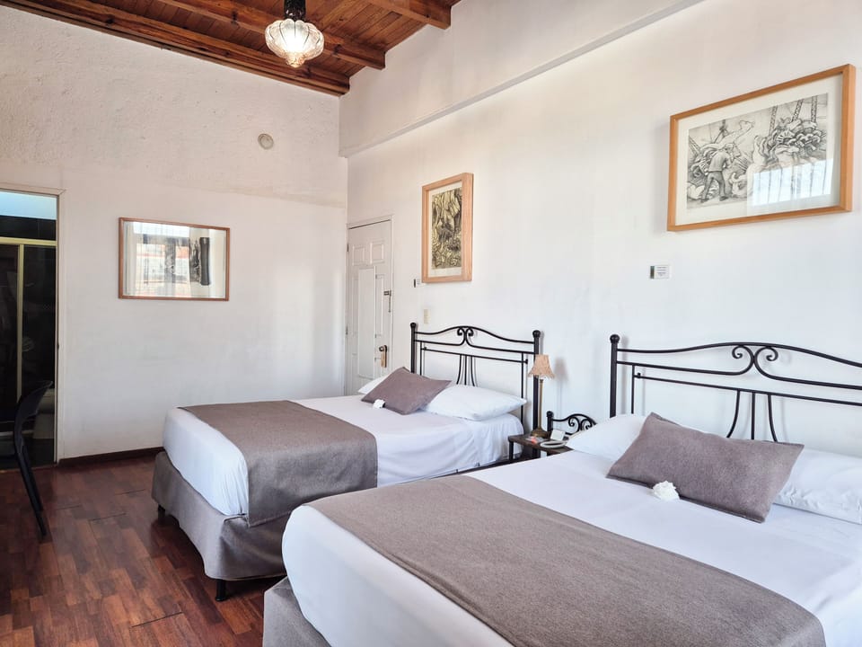 Standard Double Room, 2 Double Beds | Minibar, in-room safe, individually decorated, desk