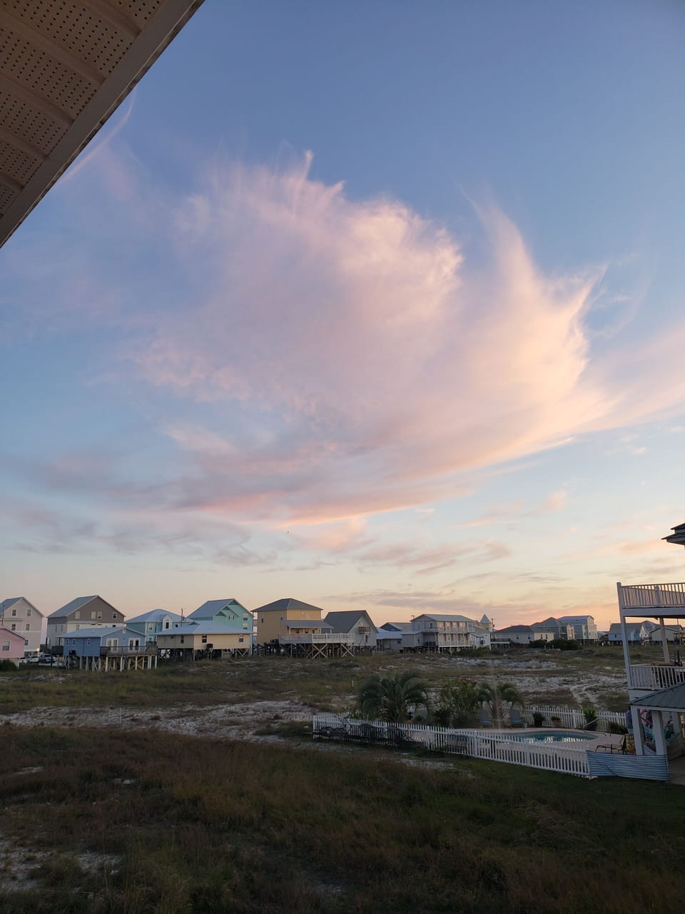 Cotton candy clouds over the beach from our back deck.