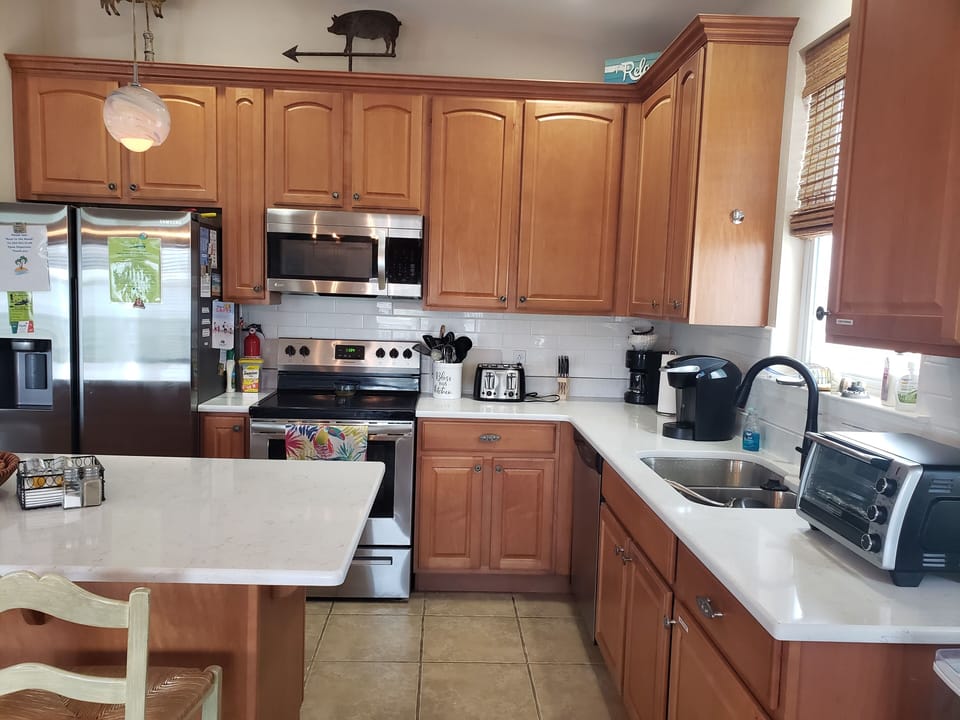 Toaster,  Toaster oven,  sharp knives, utensils galore. Nice dishes&silverware. 