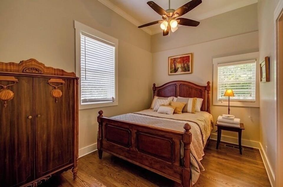 Master bedroom appointed with antique bedroom features rescued from an old B&B.