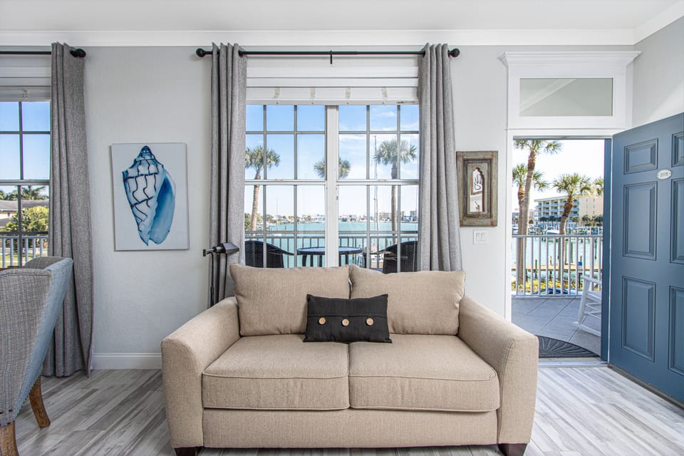 Welcome to Dock Holiday! Enjoy the water views from the windows or balcony.