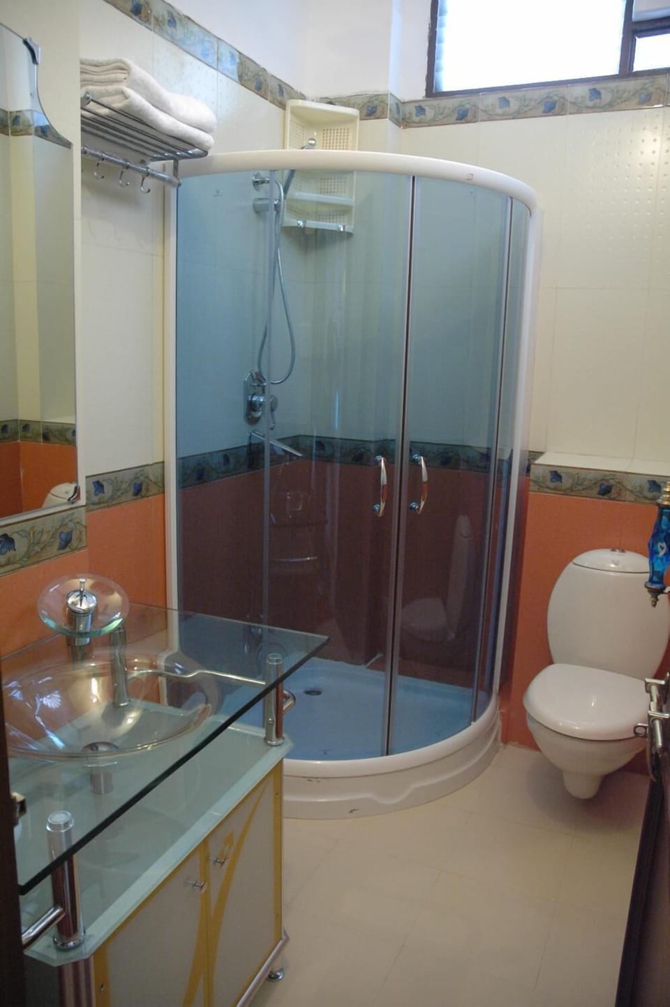 Shower, rainfall showerhead, designer toiletries, hair dryer