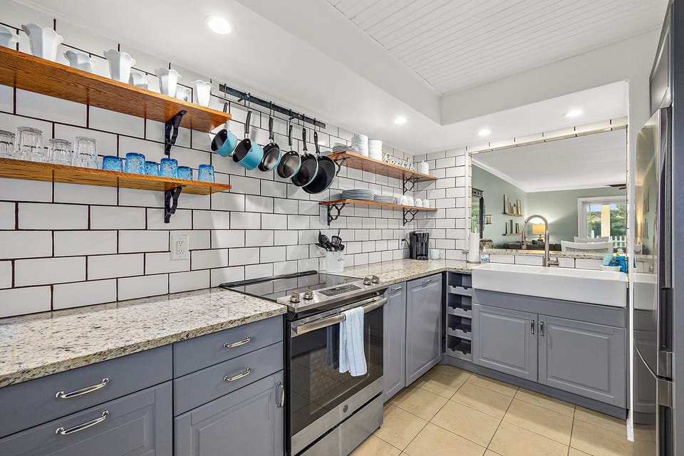 The kitchen has a full-size refrigerator, glass top stove, and convection oven.