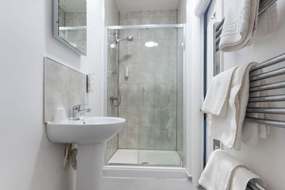 Superior Plus | Bathroom | Shower, hair dryer, towels, soap