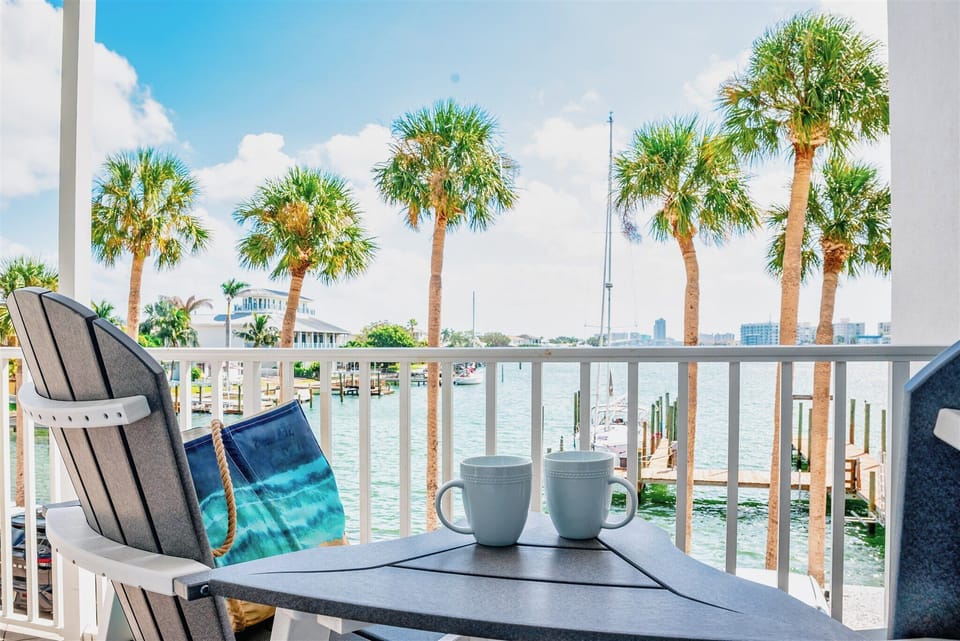 Morning coffee with peaceful harbor views—and maybe dolphins!