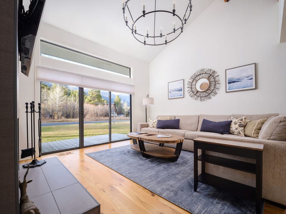 Living Room with Wood Fireplace and TV