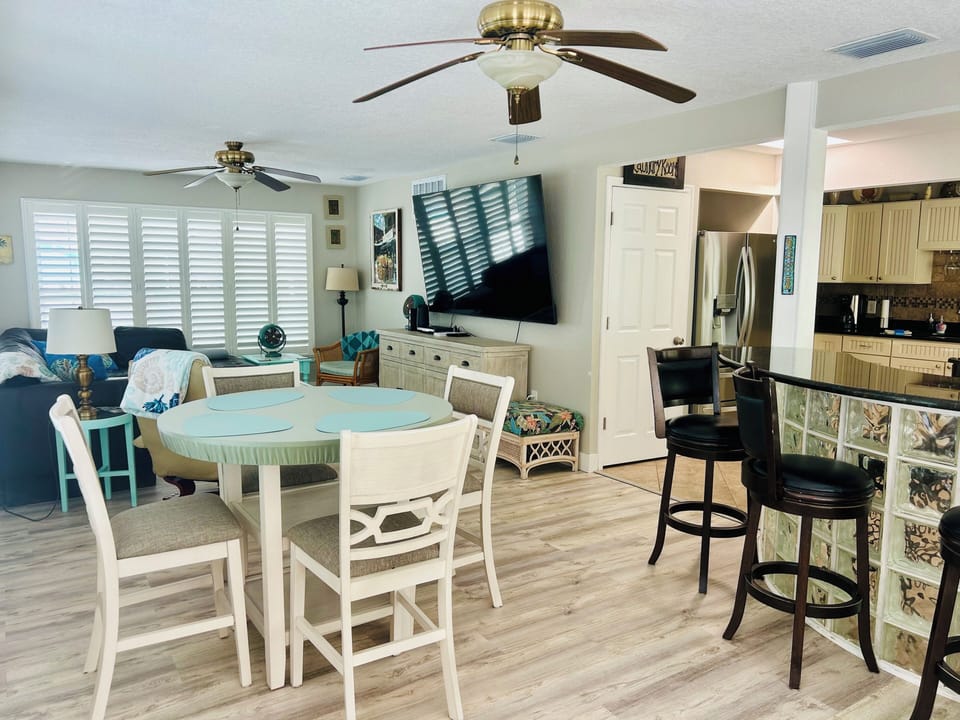 Dining/living area with 85” Smart TV