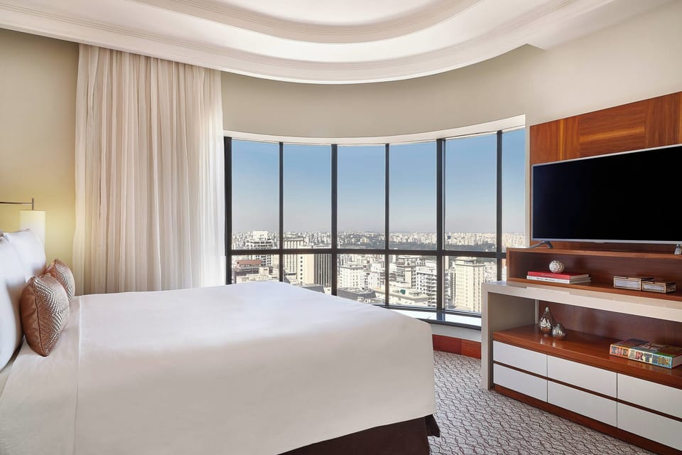 Premium bedding, down comforters, minibar, in-room safe