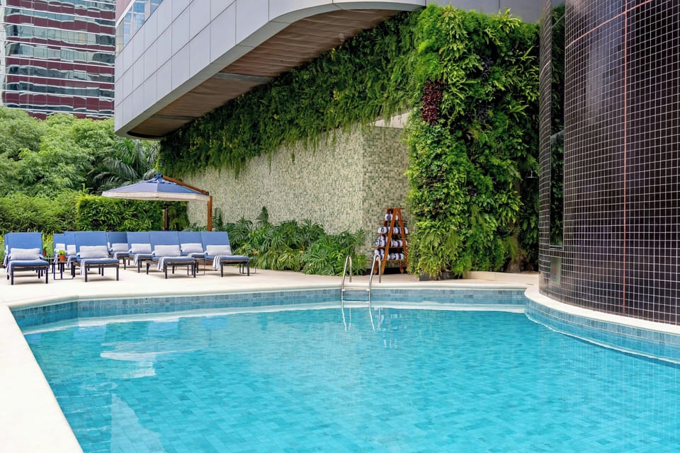 Outdoor pool, open 8:00 AM to 8:00 PM, pool umbrellas, sun loungers