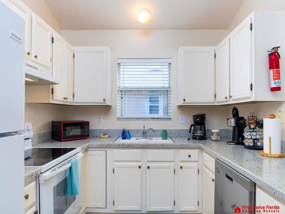 Bright, cozy kitchen with modern appliances and ample storage