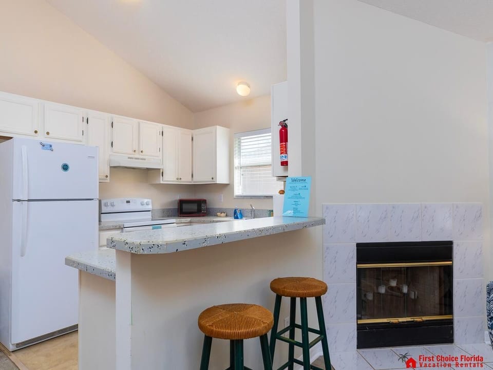 Cozy kitchen with breakfast bar and fireplace warmth