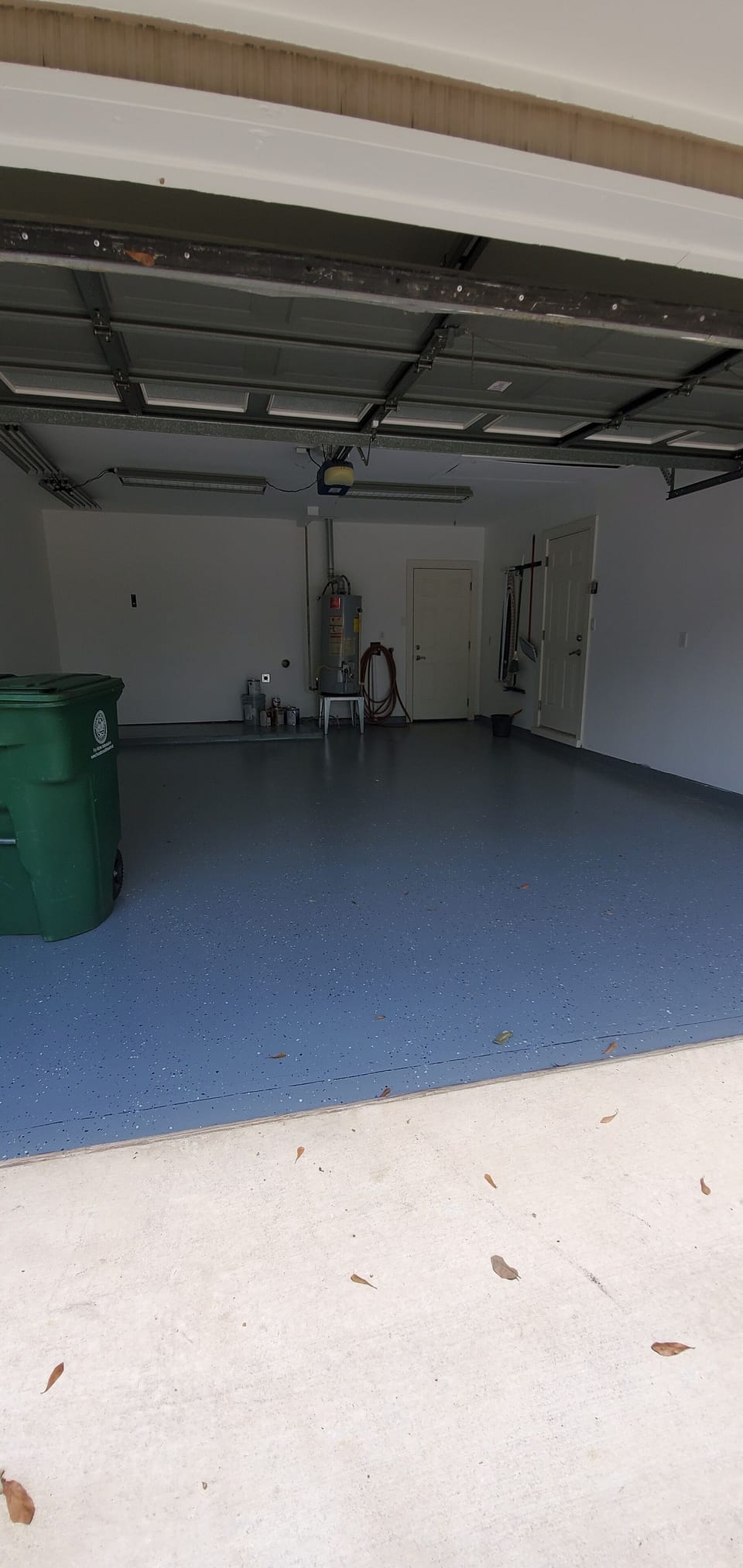 Clean Garage with weights and bench for excercise.  Nice tread mills well!