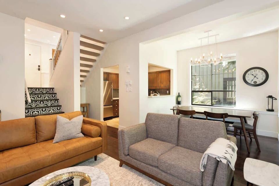 - Open-concept living and dining space filled with natural light  
- Comfy sofas and mountain-inspired artwork set a relaxing tone  
- Perfect spot to gather and enjoy cozy Whistler evenings  
