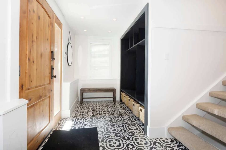 - Inviting entryway with wood door and patterned tile floor  
- Built-in storage perfect for ski gear and outdoor essentials  
- Warm welcome that sets the tone for your alpine getaway  
