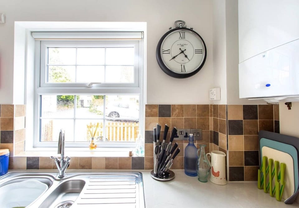 Kitchen with view into courtyard and parking space