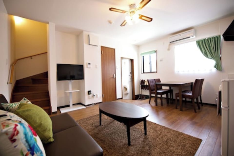 1 Bedroom Apartment | Living area | Flat-screen TV