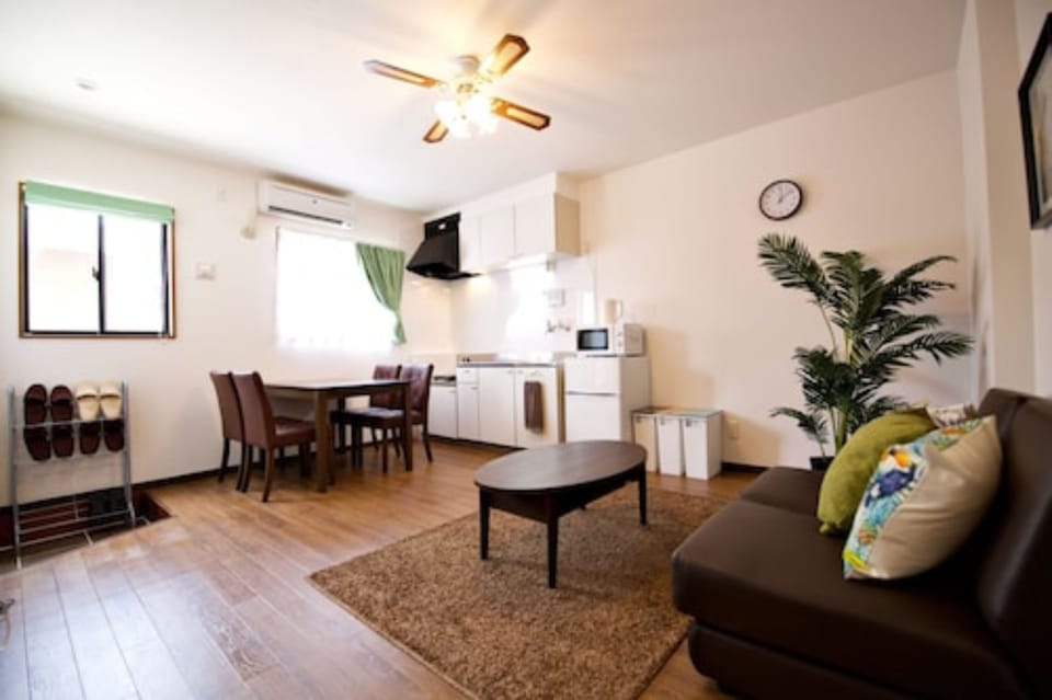 1 Bedroom Apartment | Living area | Flat-screen TV