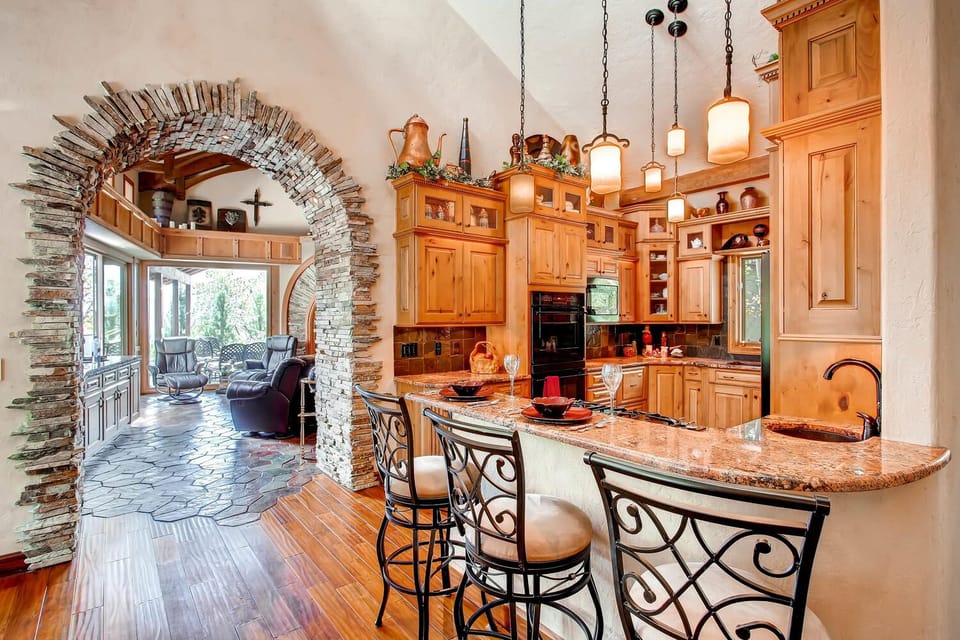 Wrought Iron, Rock, and Wood describe the Flowing Floorplan Room to Room 