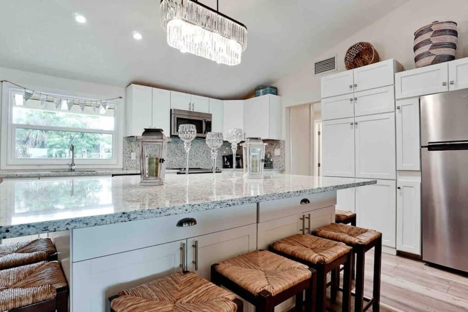 Lots of kitchen cabinets help keep the kitchen very organized.