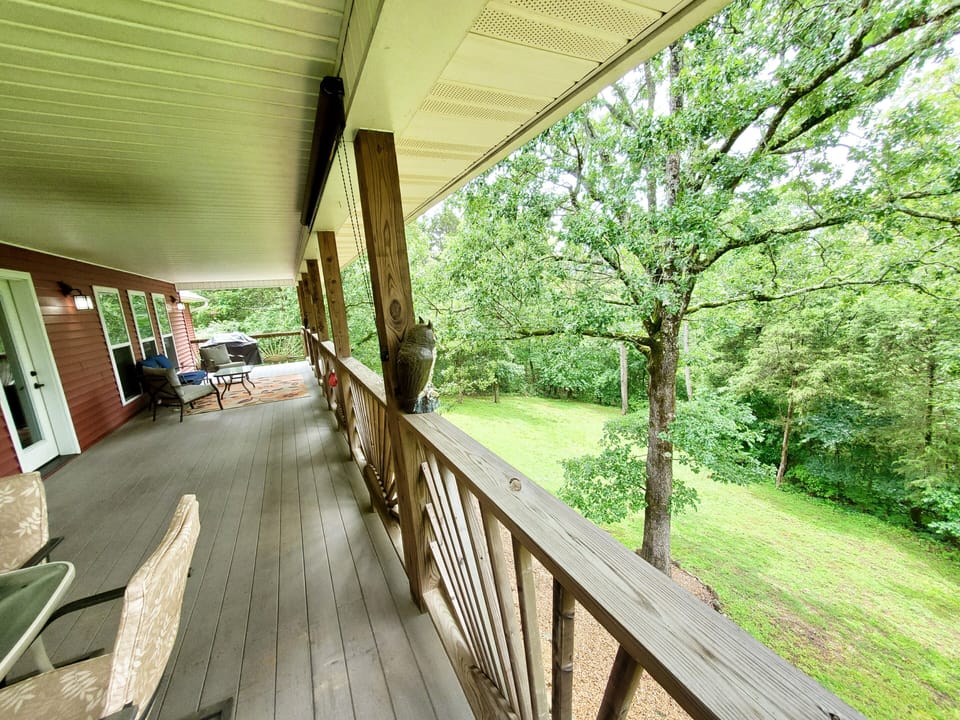 Back deck nestled in the trees. 