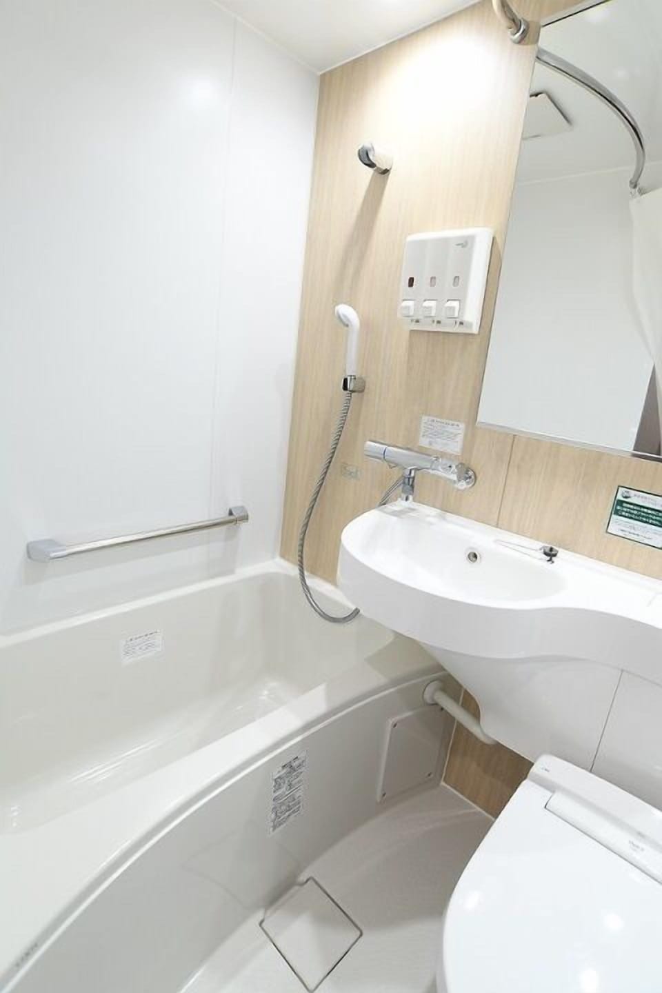 Combined shower/tub, hair dryer, slippers, bidet