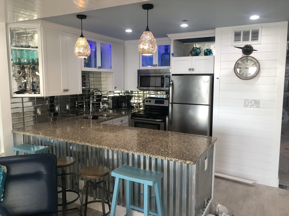 New kitchen with stainless appliances, granite tops , color changing LED lights 