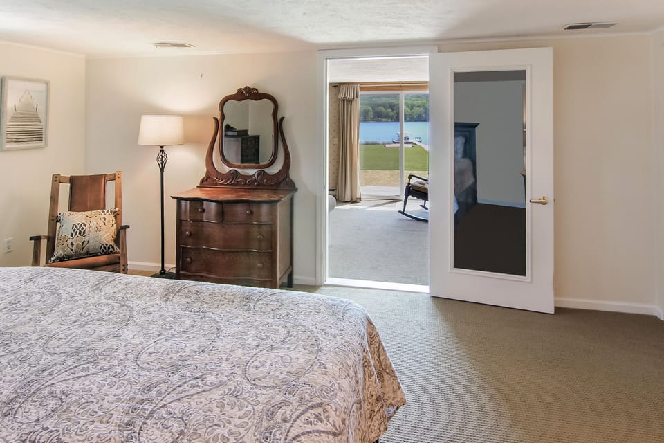 Master bedroom with a bonus sleeping area with a queen size sofa bed and 1/2 ba