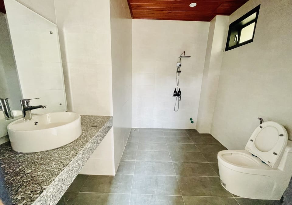 Shower, rainfall showerhead, designer toiletries, hair dryer