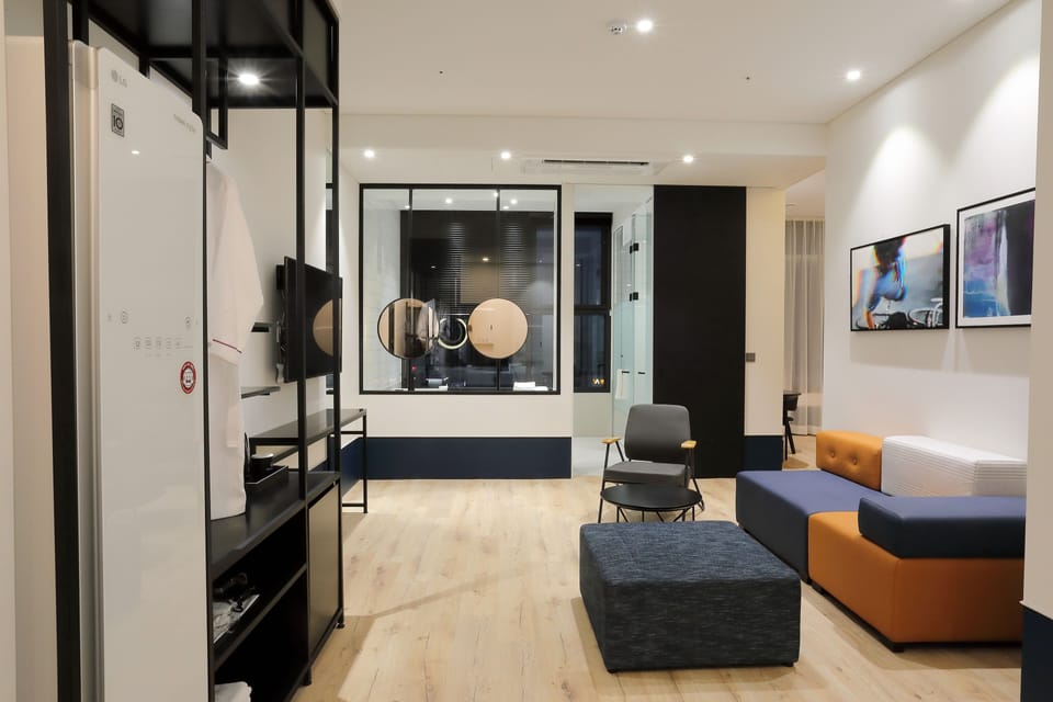 Royal Triple Room | Living area | Flat-screen TV